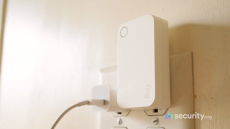 Here’s the range extender plugged into a wall outlet; an old iPhone charging adapter is shown for scale. Ring Alarm Range Extender (2nd Gen)