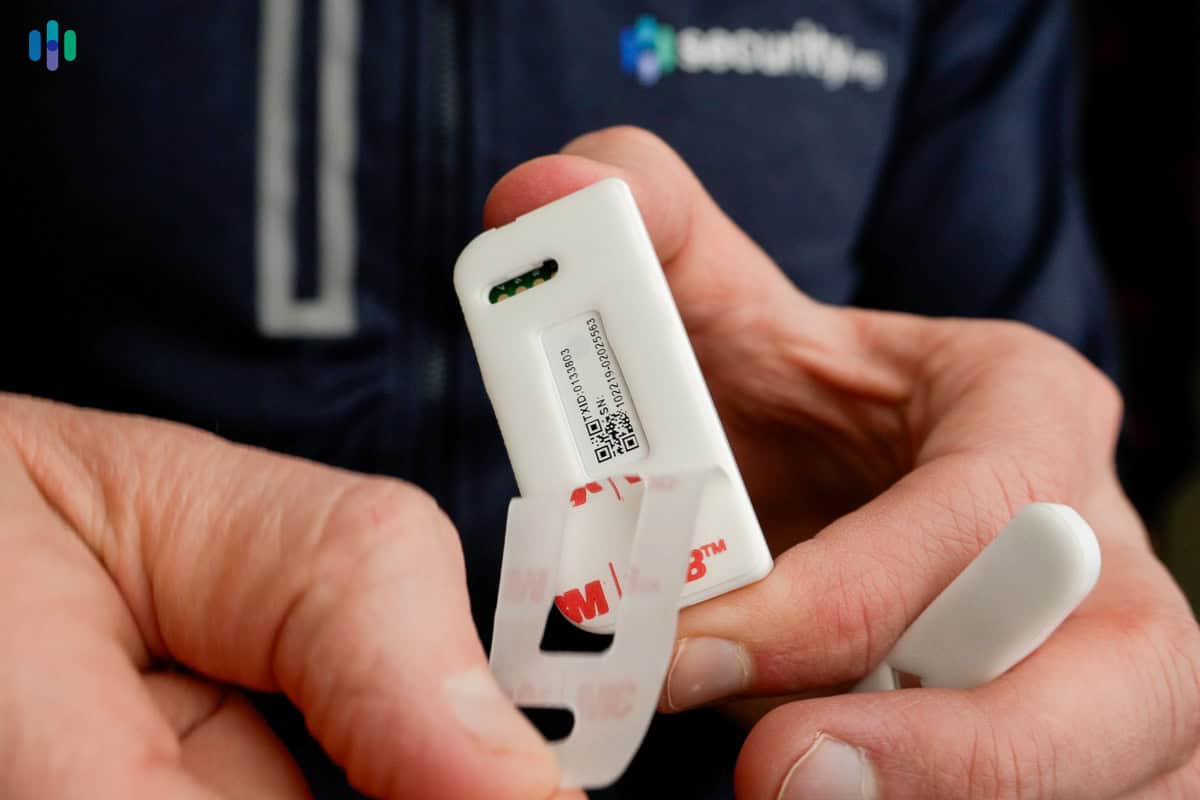 Peeling the adhesive on Cove’s door/window sensor Peeling the adhesive on Cove's door/window sensor