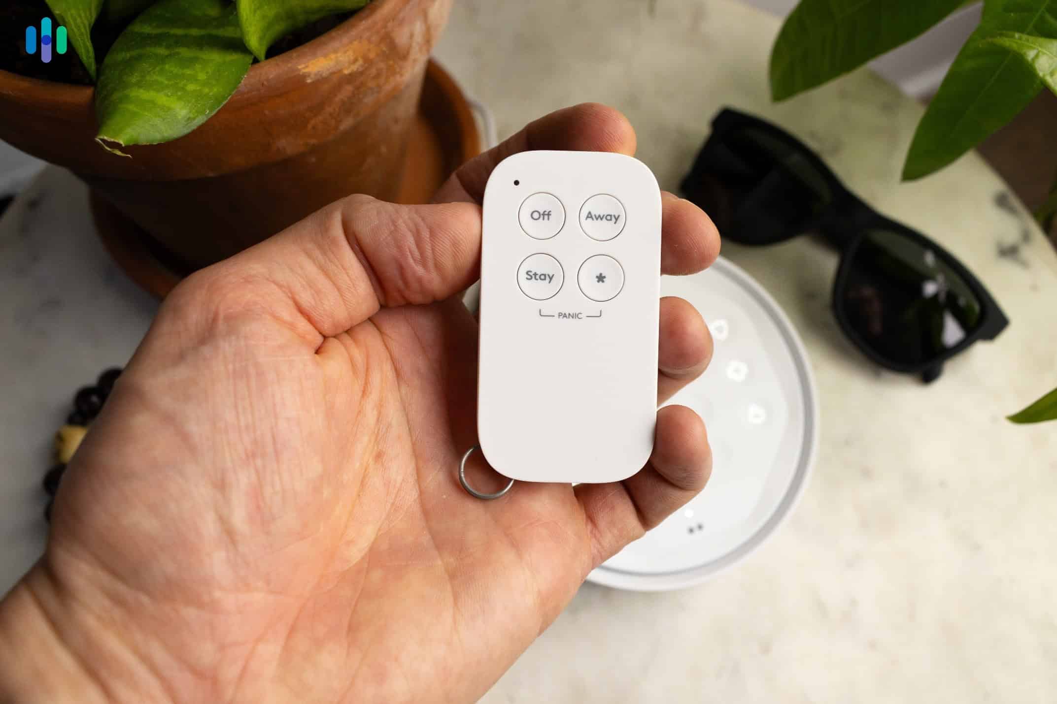 Holding ADT Keychain Remote Holding ADT Keychain Remote